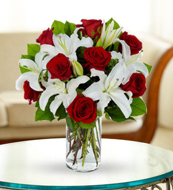 White Stargazer Lilies And Red Roses