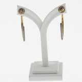 Black diamond hoops in silver and yellow gold
