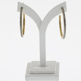 Black diamond hoops in silver and yellow gold