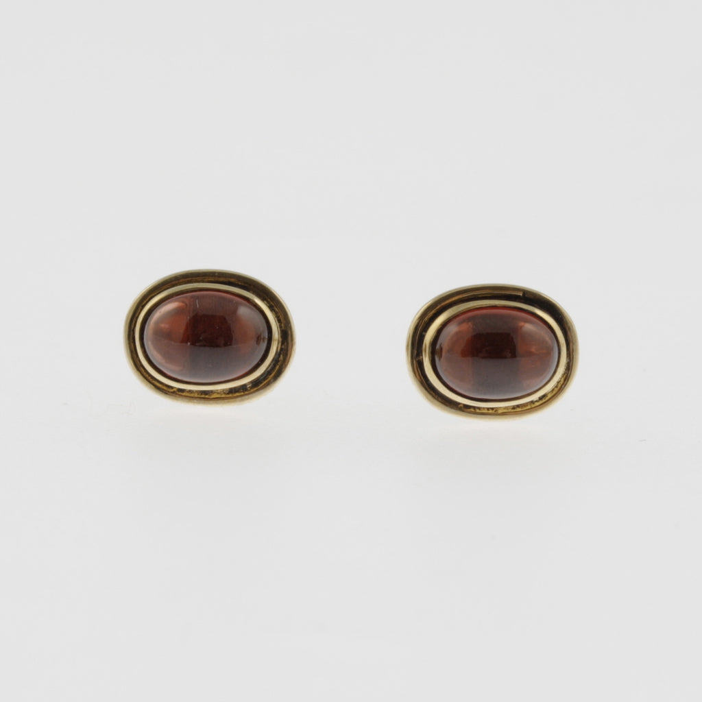 Garnet yellow gold oval studs