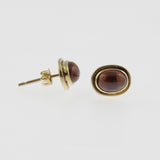 Garnet yellow gold oval studs