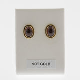 Garnet yellow gold oval studs