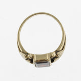 Vintage style emerald cut garnet yellow gold ring with leaf detail